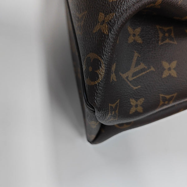 RIVOLI MM Monogram Coated Canvas Brown