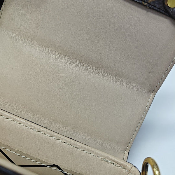 TRUNK Monogram Coated Canvas Brown