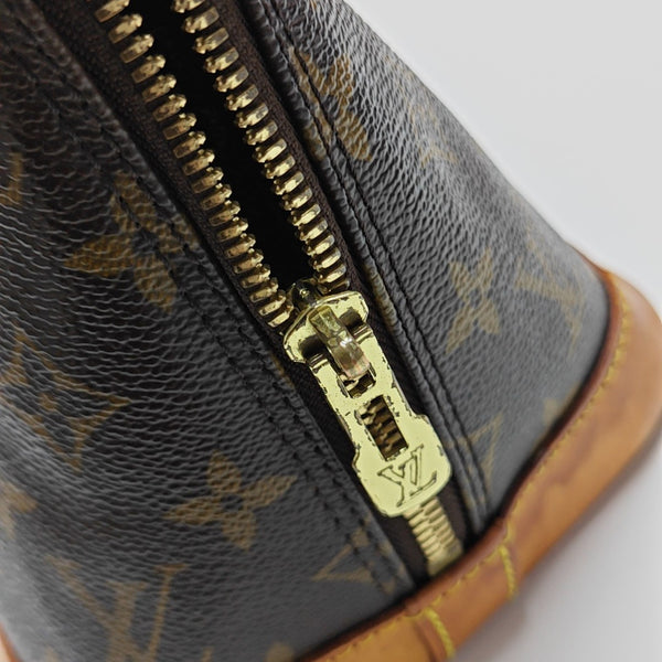 ALMA PM Monogram Coated Canvas Brown