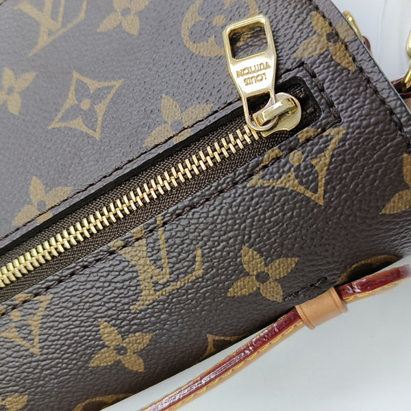 MÉTIS EAST WEST Monogram Coated Canvas Brown