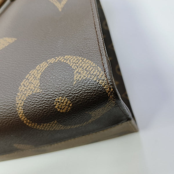 ONTHEGO MM Monogram Coated Canvas Brown