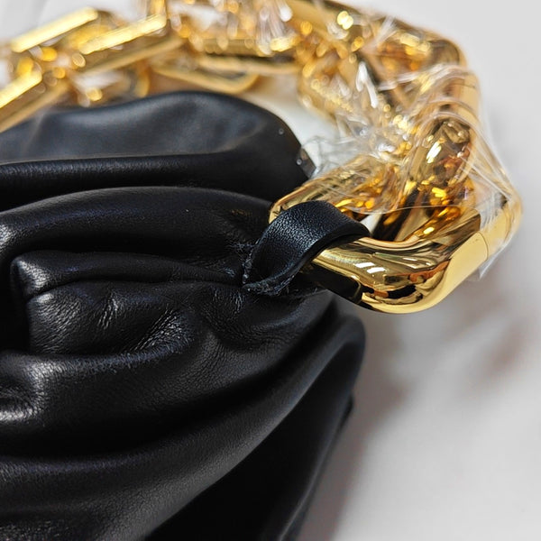 Authenticated pre-owned The Pouch Calfskin Black - Top Handle Bag at Looply