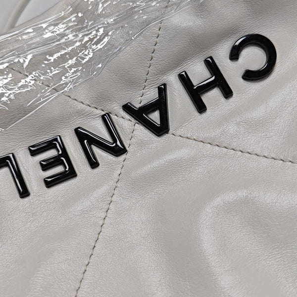 Authenticated pre-owned CHANEL 22 Mini Quilted Calfskin White - Tote Bag at Looply