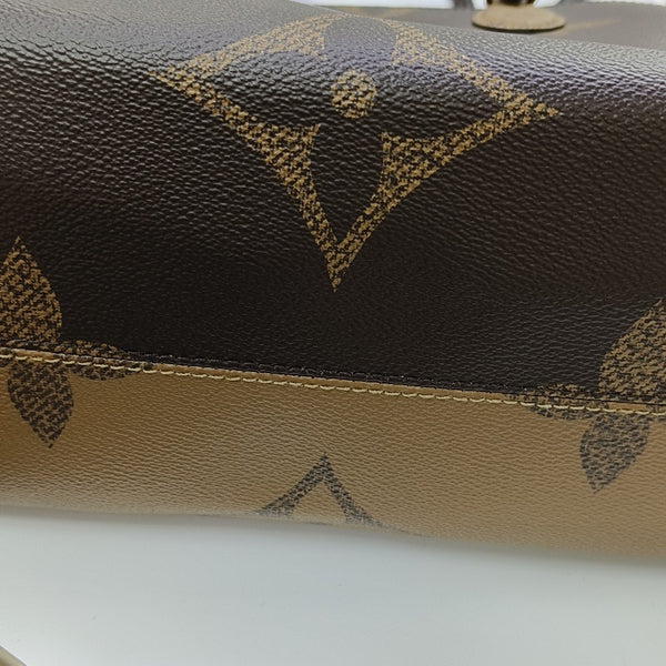 ONTHEGO MM Monogram Coated Canvas Brown