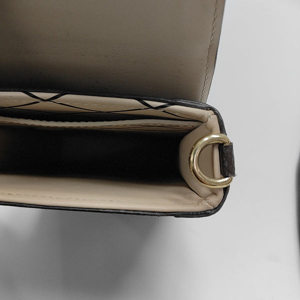 TRUNK Monogram Coated Canvas Brown