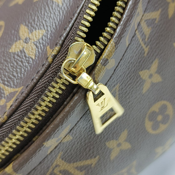 Mochila de lona revestida con monograma, color marrón