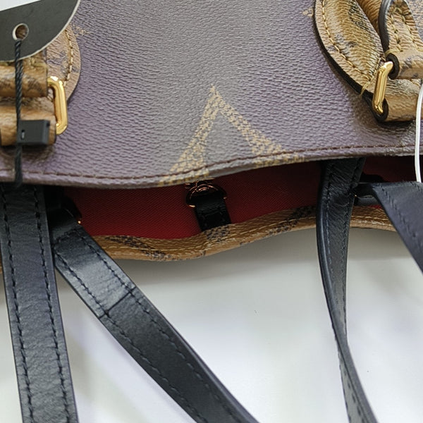 ONTHEGO MM Monogram Coated Canvas Brown