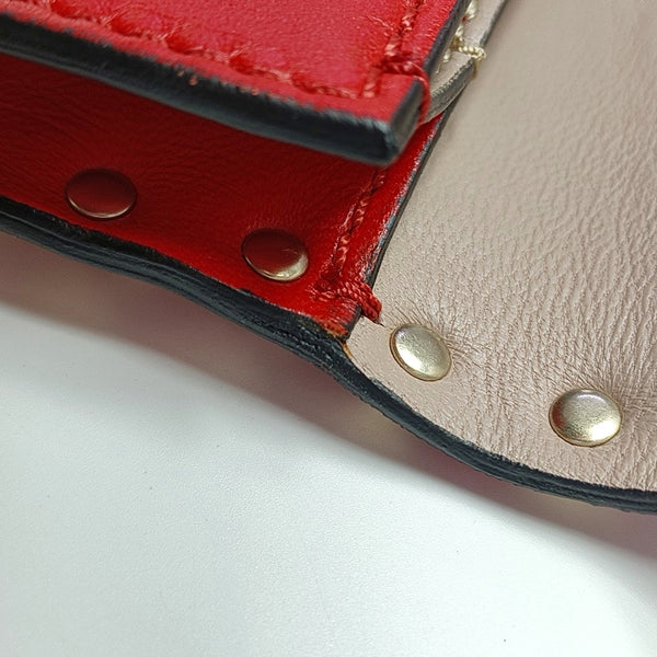 Authenticated pre-owned Rockstud Lambskin Red - Clutch at Looply
