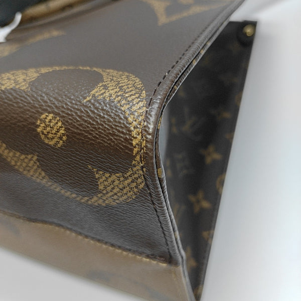 ONTHEGO MM Monogram Coated Canvas Brown