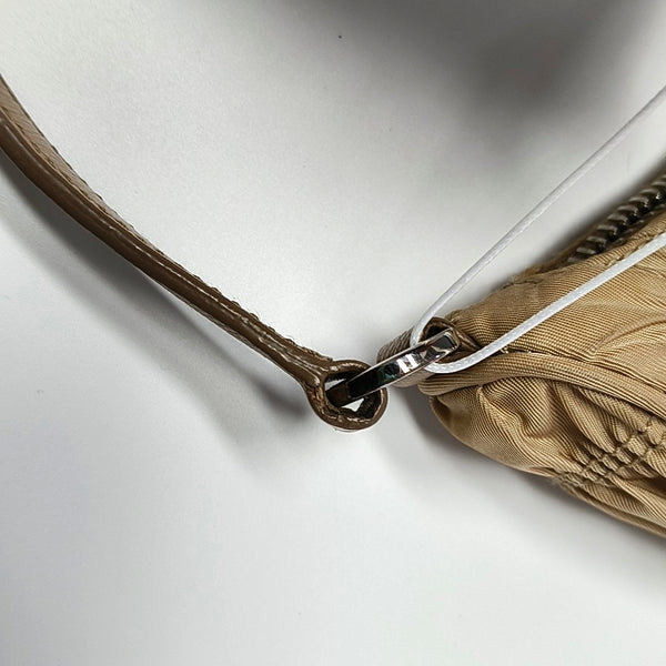 Authenticated pre-owned Re-Edition2005 Mini Quilted Nylon Beige - Top Handle Bag at Looply
