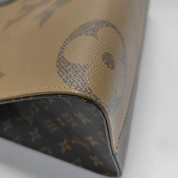 ONTHEGO MM Monogram Coated Canvas Brown