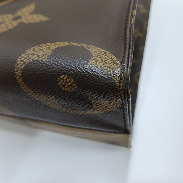 ONTHEGO MM Monogram Coated Canvas Brown
