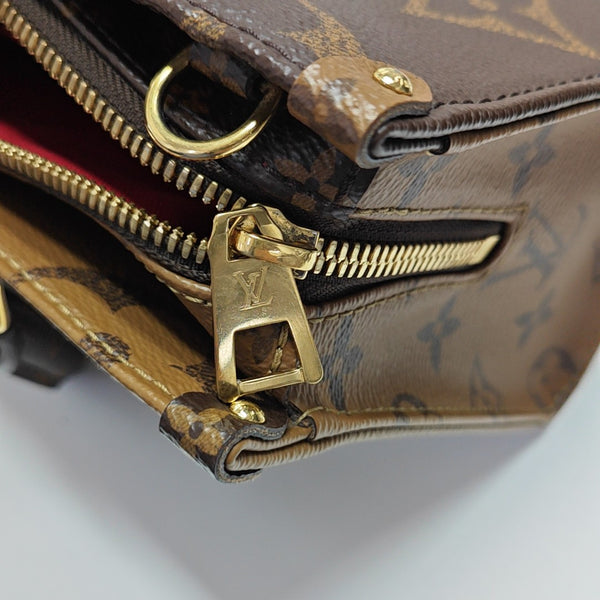 ONTHEGO EAST WEST PM Monogram Coated Canvas Brown