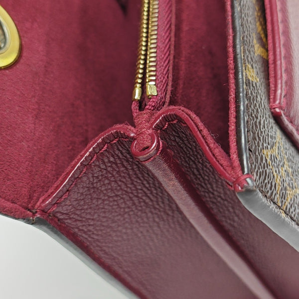 VICTOIRE Monogram Coated Canvas Brown