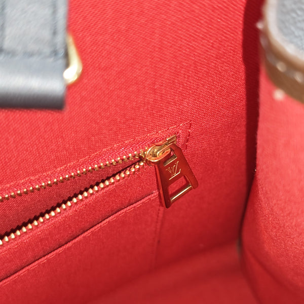 ONTHEGO MM Monogram Coated Canvas Brown