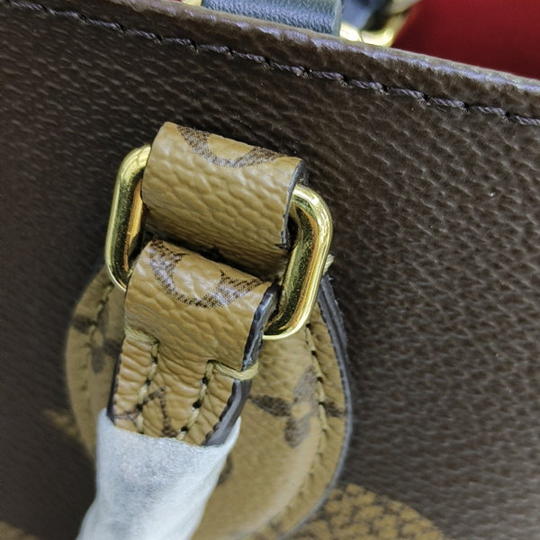 ONTHEGO MM Monogram Coated Canvas Brown