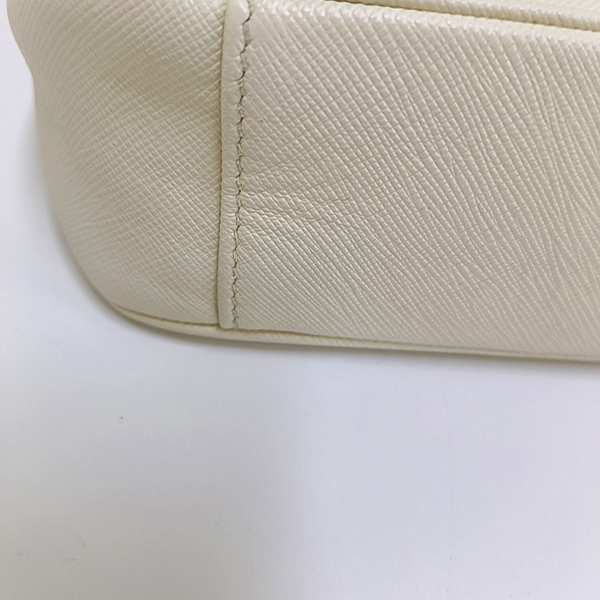 Authenticated pre-owned Re-Edition2005 Saffiano Calfskin White - Crossbody Bag at Looply