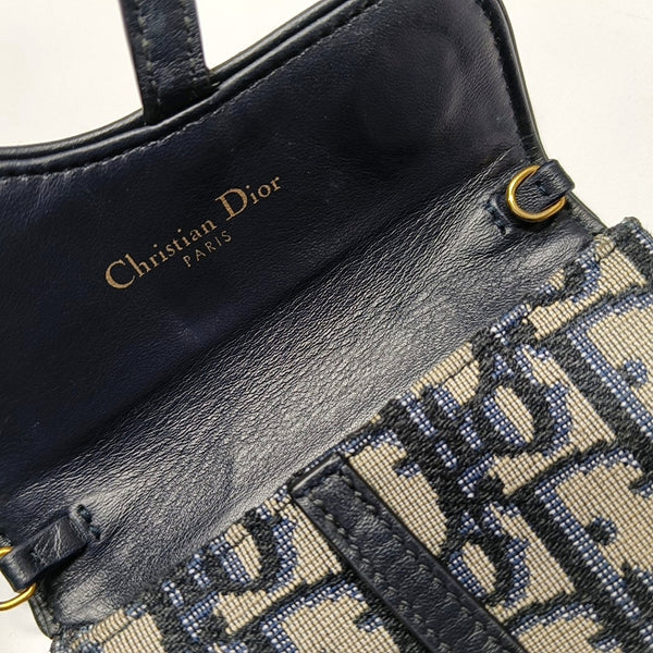 Authenticated pre-owned Saddle Oblique Canvas Blue - Clutch at Looply