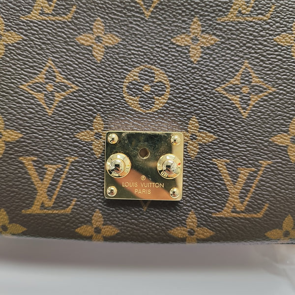 MÉTIS EAST WEST Monogram Coated Canvas Brown