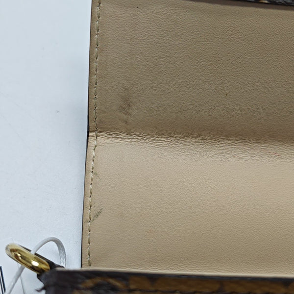 TRUNK Monogram Coated Canvas Brown