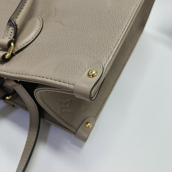 Authenticated pre-owned ONTHEGO MM Monogram Calfskin Grey - Tote Bag at Looply
