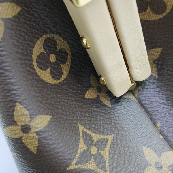 CLUTCH Monogram Coated Canvas Brown