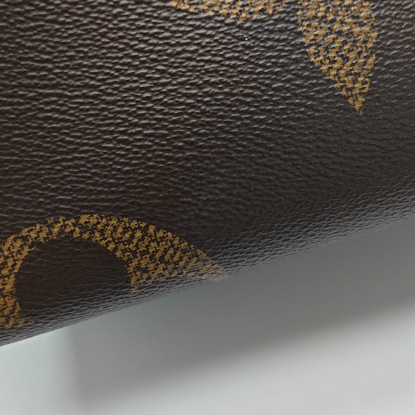 ONTHEGO MM Monogram Coated Canvas Brown