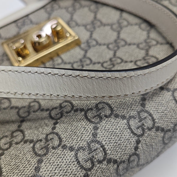 Padlock Small Monogram Coated Canvas Beige