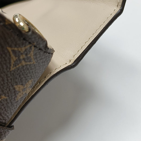 TRUNK Monogram Coated Canvas Brown