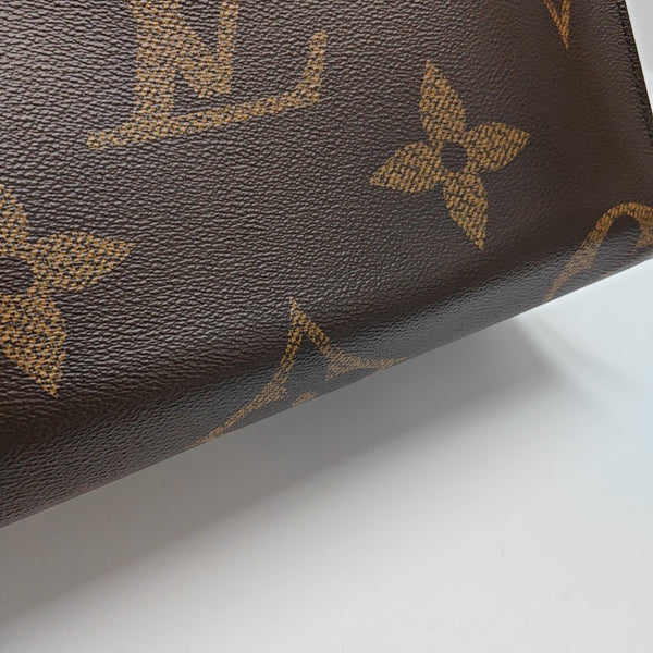 ONTHEGO MM Monogram Coated Canvas Brown