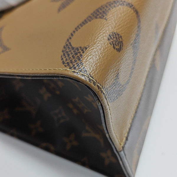 ONTHEGO MM Monogram Coated Canvas Brown