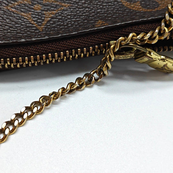 Authenticated pre-owned ACCESSOIRES Mini Monogram Coated Canvas Brown - Top Handle Bag at Looply
