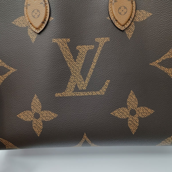 ONTHEGO MM Monogram Coated Canvas Brown