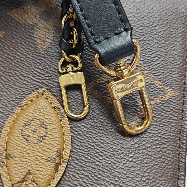 ONTHEGO EAST WEST PM Monogram Coated Canvas Brown