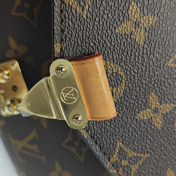 MÉTIS EAST WEST Monogram Coated Canvas Brown
