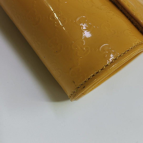 Monogram Patent Leather Clutch Yellow