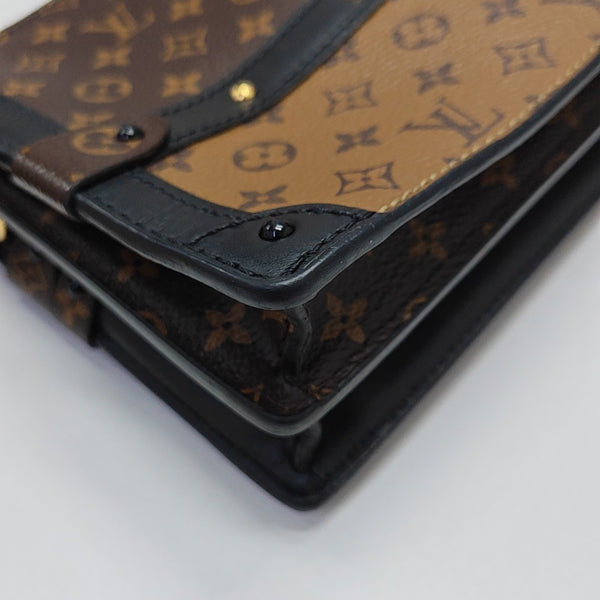 TRUNK Monogram Coated Canvas Brown