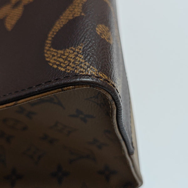 ONTHEGO MM Monogram Coated Canvas Brown