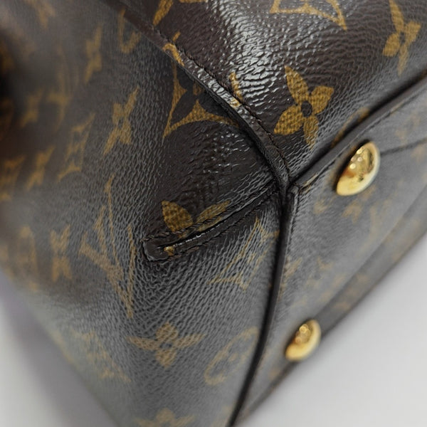 MONTAIGNE GM Monogram Coated Canvas Brown