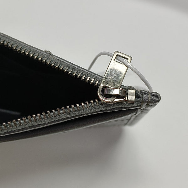Authenticated pre-owned CASSANDRE Chevron, Quilted Calfskin Gray - Clutch at Looply