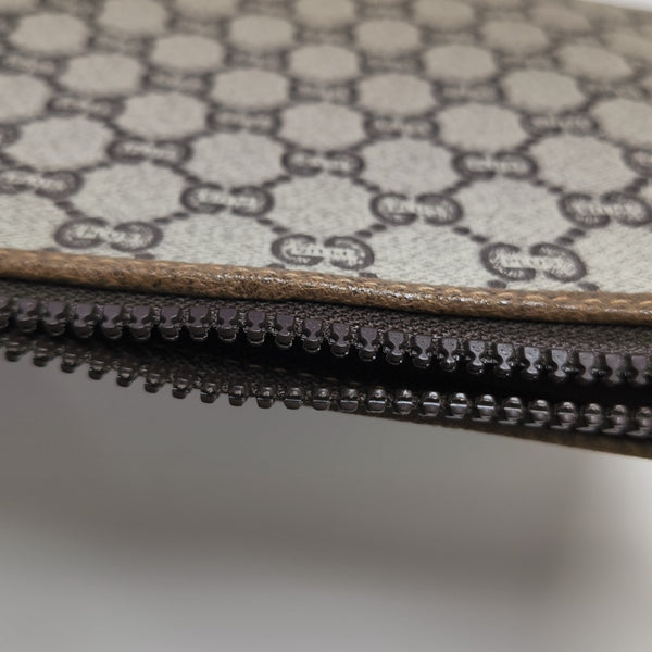 Monogram Coated Canvas Clutch Beige