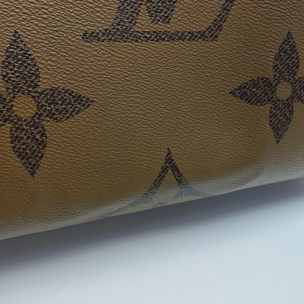 ONTHEGO MM Monogram Coated Canvas Brown