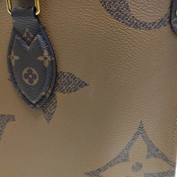 ONTHEGO MM Monogram Coated Canvas Brown