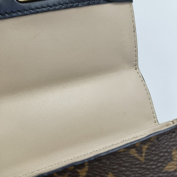 TRUNK Monogram Coated Canvas Brown