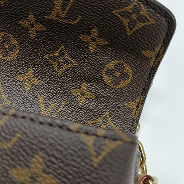 MÉTIS EAST WEST Monogram Coated Canvas Brown