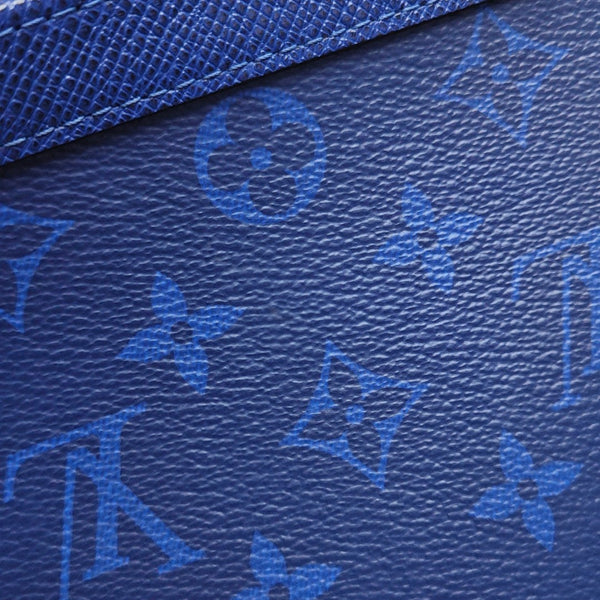 Pochette Voyag MM Monogram Coated Canvas Blue