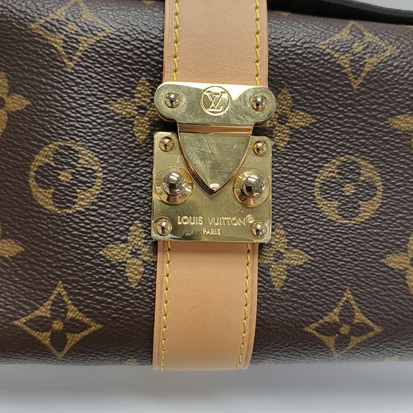 Pochette Mia Monogram Coated Canvas Brown