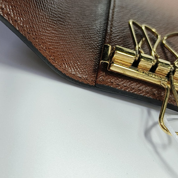 Monogram Coated Canvas Clutch Brown