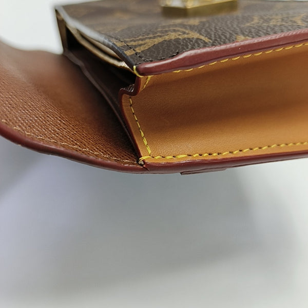 S LOCK Monogram Coated Canvas Brown
