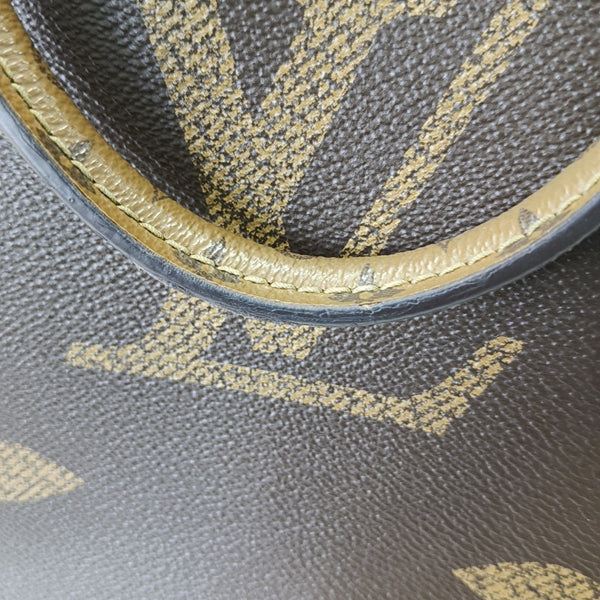 ONTHEGO MM Monogram Coated Canvas Brown